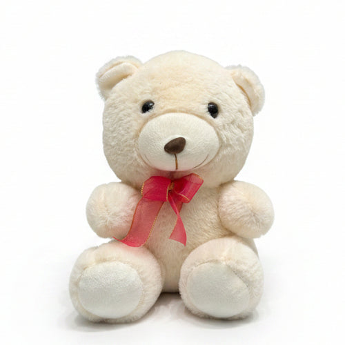Small white teddy bear with a pink bow attached to a curtain.