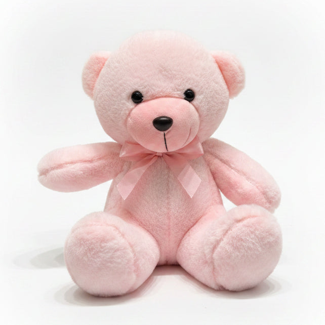 Pink teddy bear with a bow tie on a marble surface with a blurred background