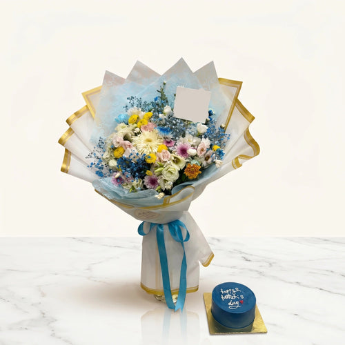Bouquet of flowers with a 'Happy Father's Day' card and a small blue cake on a white background