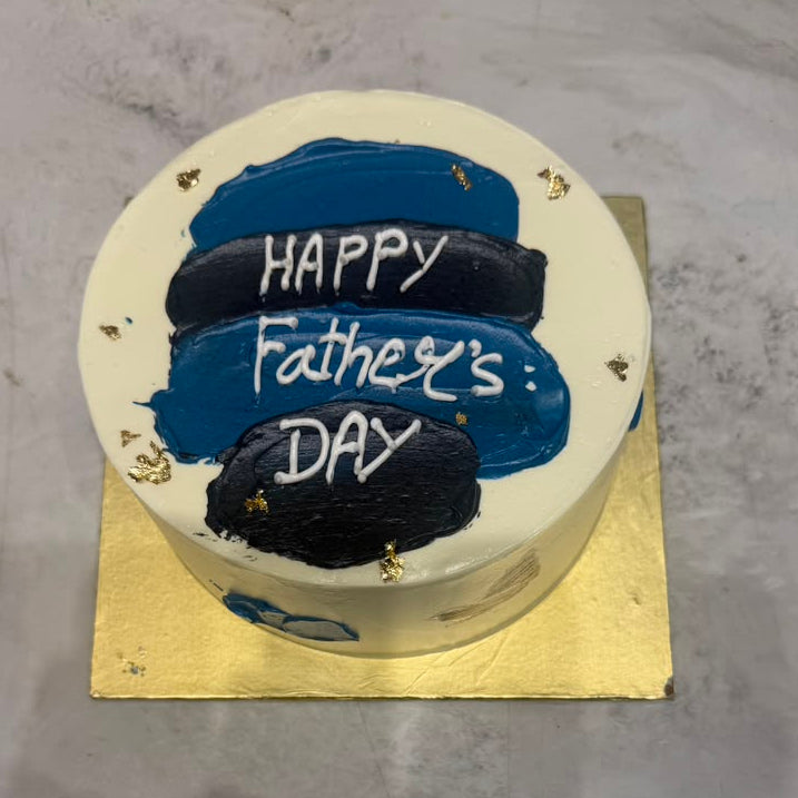 Father's Day cake with police hats and 'Happy Father's Day' text on a metallic surface.